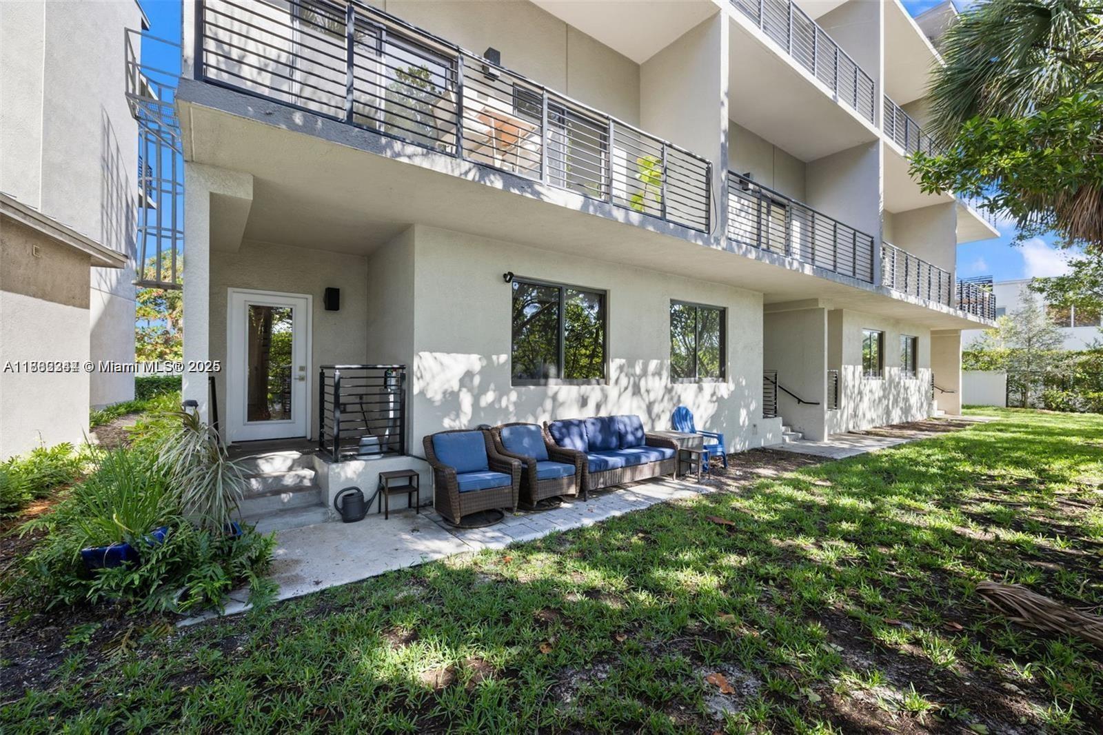 532 Southeast 1st Circle Pompano Beach, FL 33060 - Photo 55 of 57 a view of a chair and tables in the patio of the house