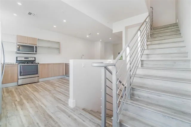 a view of a kitchen with furniture and a window