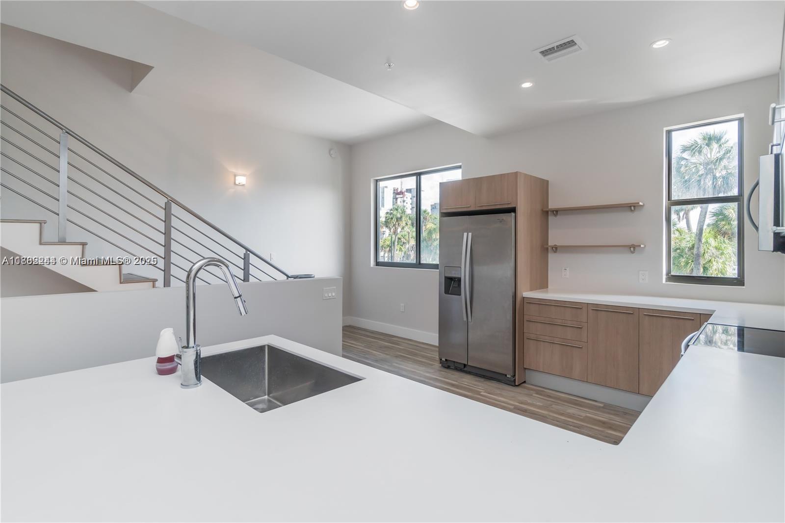 532 Southeast 1st Circle Pompano Beach, FL 33060 - Photo 8 of 57 a view of a kitchen with furniture and a window