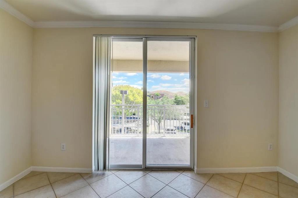 6565 Emerald Dunes Drive, Unit 301 West Palm Beach, FL 33411 - Photo 13 of 32 a view of an empty room and window