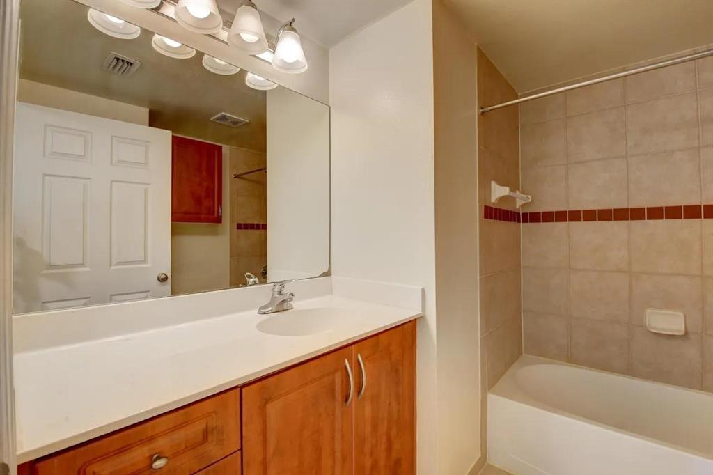6565 Emerald Dunes Drive, Unit 301 West Palm Beach, FL 33411 - Photo 24 of 32 a bathroom with a bathtub a sink and a shower