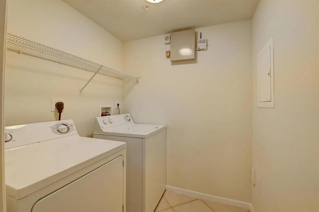 6565 Emerald Dunes Drive, Unit 301 West Palm Beach, FL 33411 - Photo 25 of 32 a utility room with dryer and washer