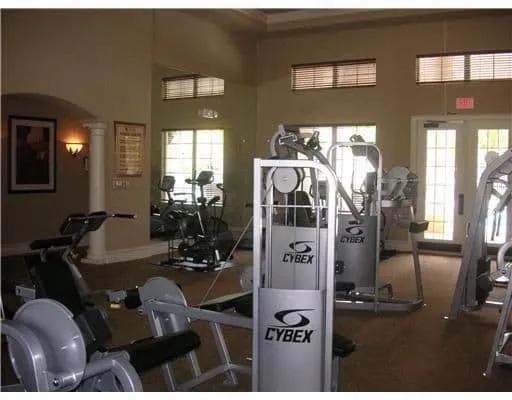 6565 Emerald Dunes Drive, Unit 301 West Palm Beach, FL 33411 - Photo 27 of 32 a living room with furniture and a floor to ceiling window