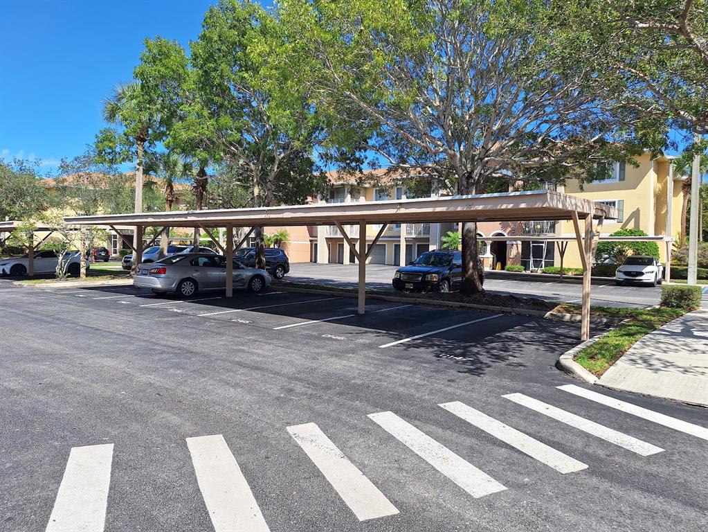 6565 Emerald Dunes Drive, Unit 301 West Palm Beach, FL 33411 - Photo 5 of 32 a view of street from a house