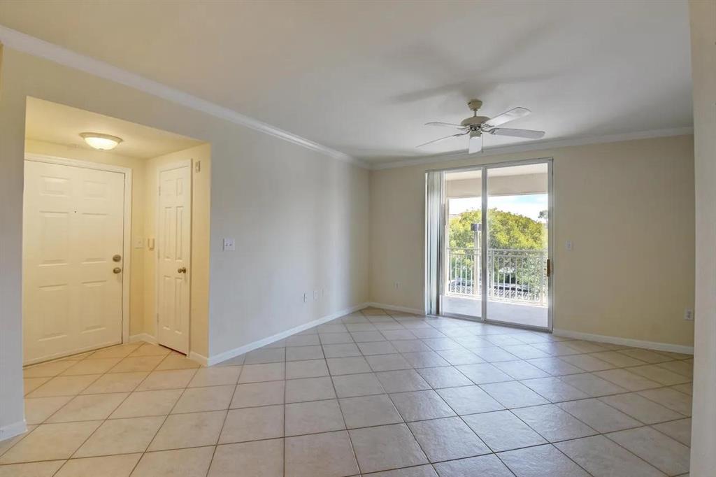 6565 Emerald Dunes Drive, Unit 301 West Palm Beach, FL 33411 - Photo 7 of 32 a view of an empty room and window
