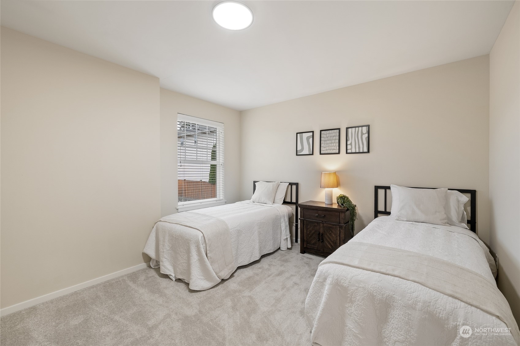 4022 222nd Place Southeast Bothell, WA 98021 - Photo 22 of 40 a bedroom with two beds and a night stand