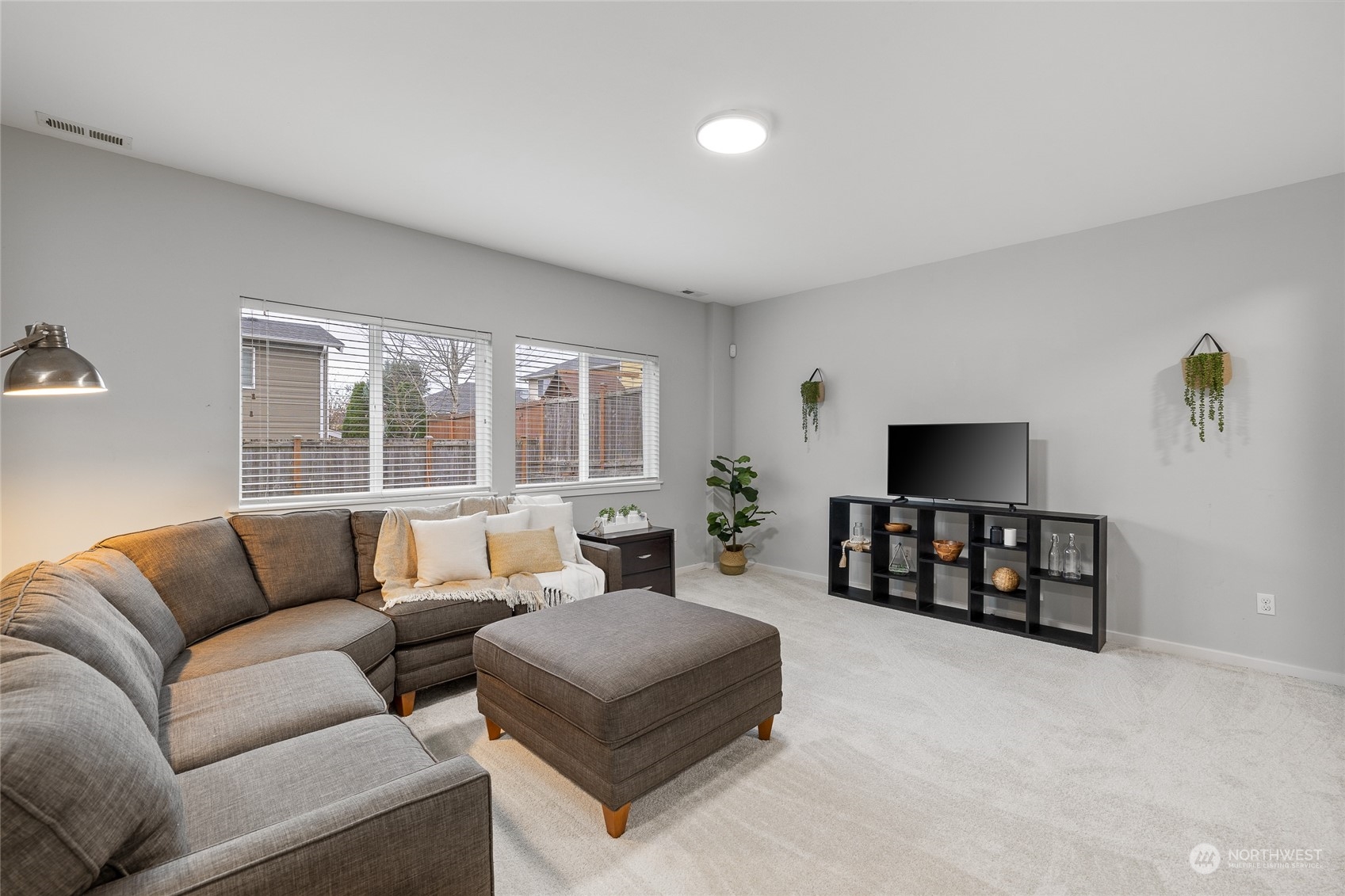 4022 222nd Place Southeast Bothell, WA 98021 - Photo 25 of 40 a living room with furniture window and a flat screen tv