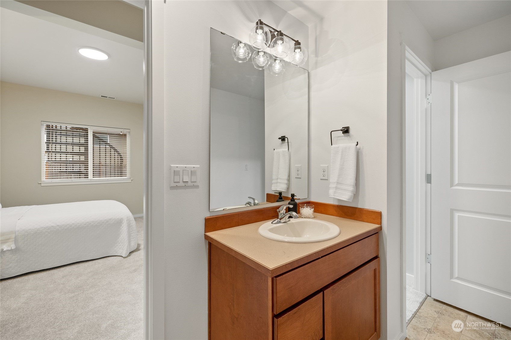 4022 222nd Place Southeast Bothell, WA 98021 - Photo 30 of 40 a bathroom with a sink a tub and a mirror