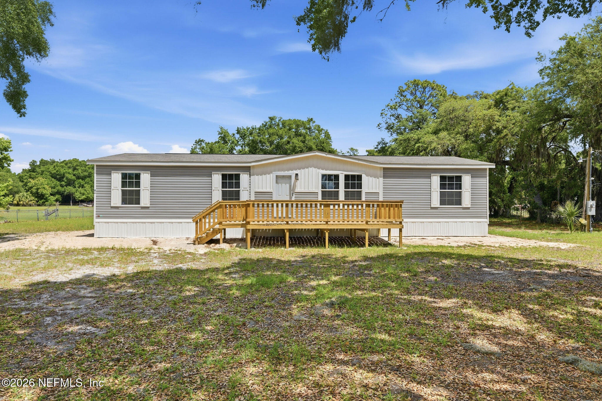101 Oakhaven Road Pomona Park, FL 32181 - Photo 1 of 23 a view of a house with a backyard