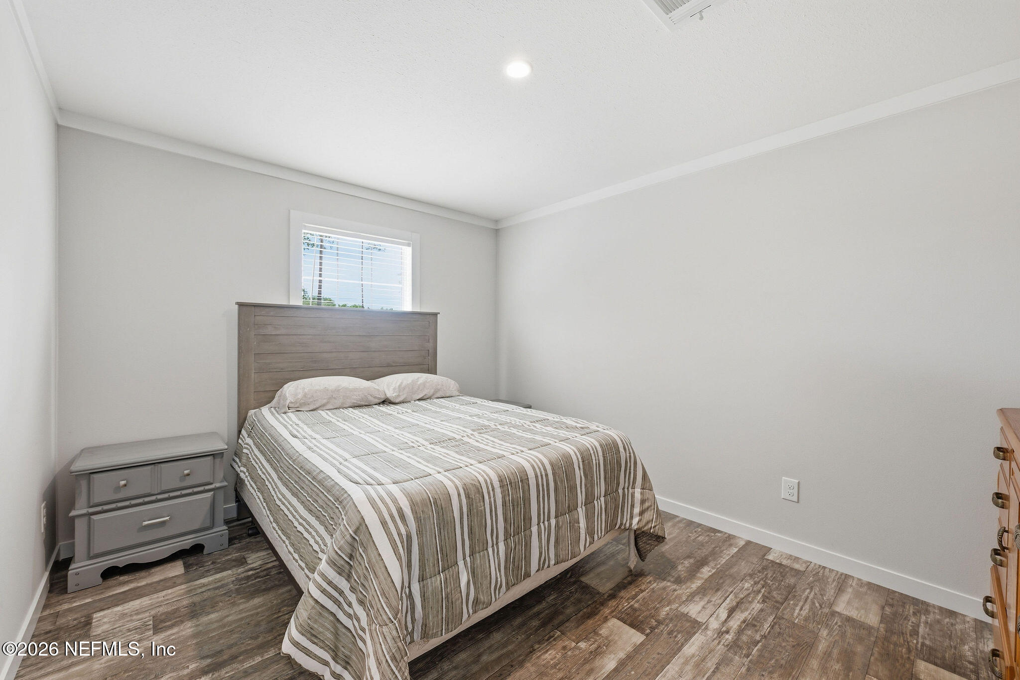 101 Oakhaven Road Pomona Park, FL 32181 - Photo 11 of 23 a bedroom with a bed and a dresser