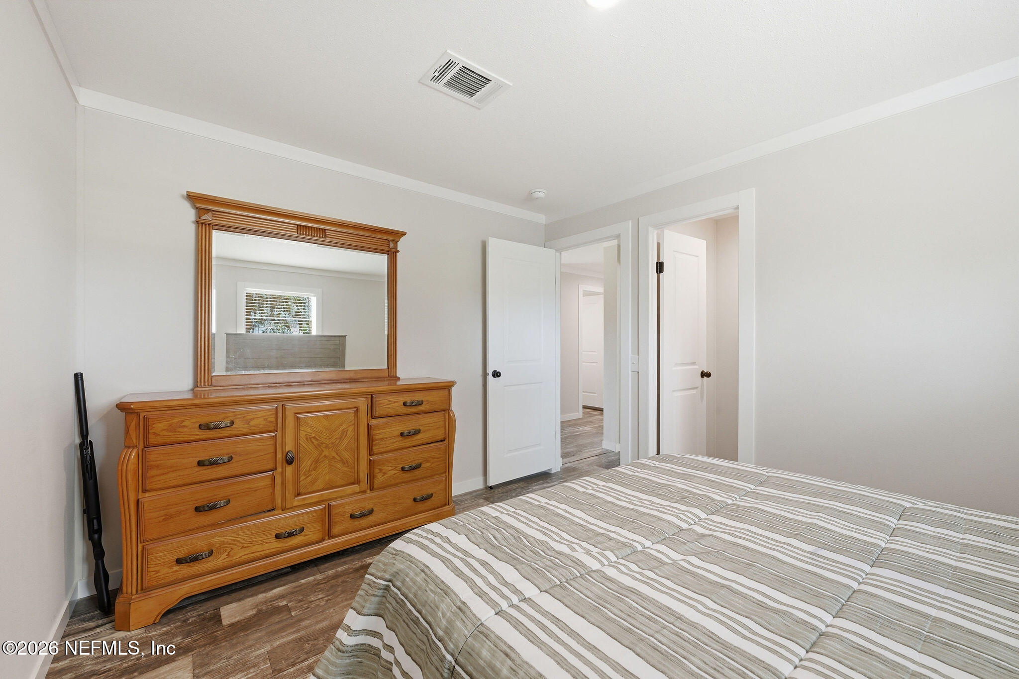 101 Oakhaven Road Pomona Park, FL 32181 - Photo 12 of 23 a bedroom with a bed and a dresser