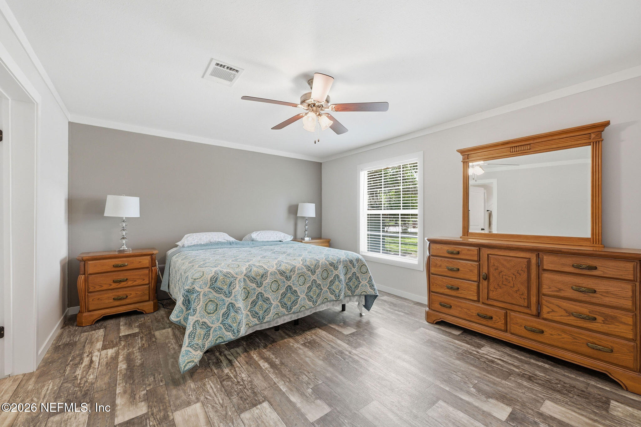 101 Oakhaven Road Pomona Park, FL 32181 - Photo 13 of 23 a bedroom with a bed and a dresser