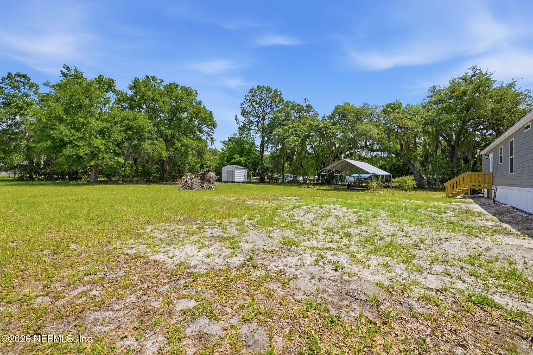 101 Oakhaven Road Pomona Park, FL 32181 - Photo 19 of 23 a view of a field with an trees in the background