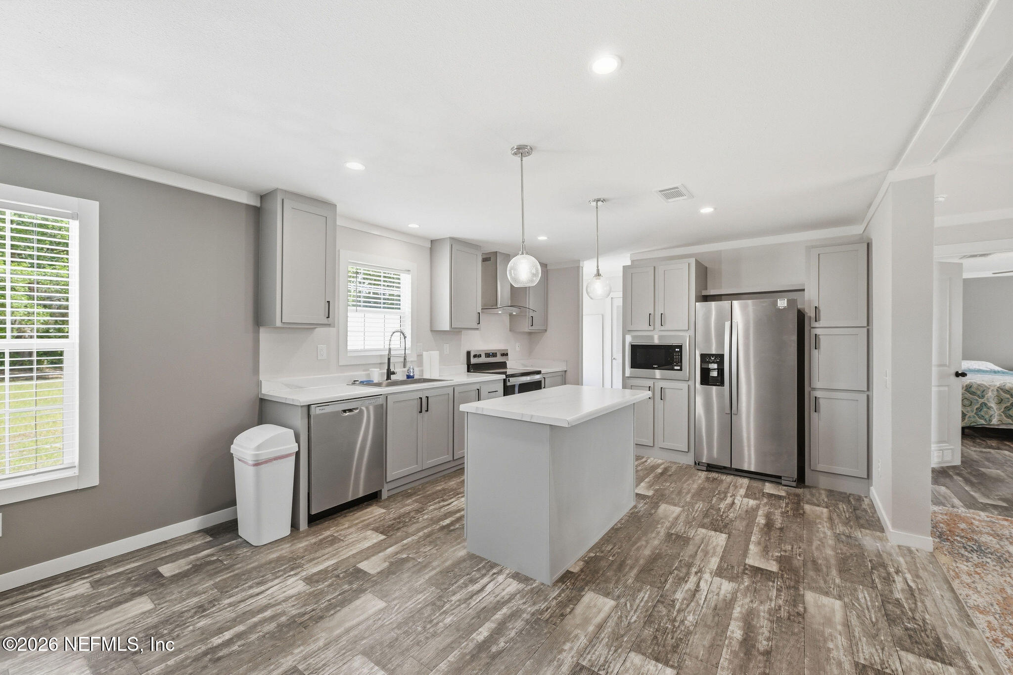 101 Oakhaven Road Pomona Park, FL 32181 - Photo 2 of 23 a large kitchen with a lot of counter space and stainless steel appliances