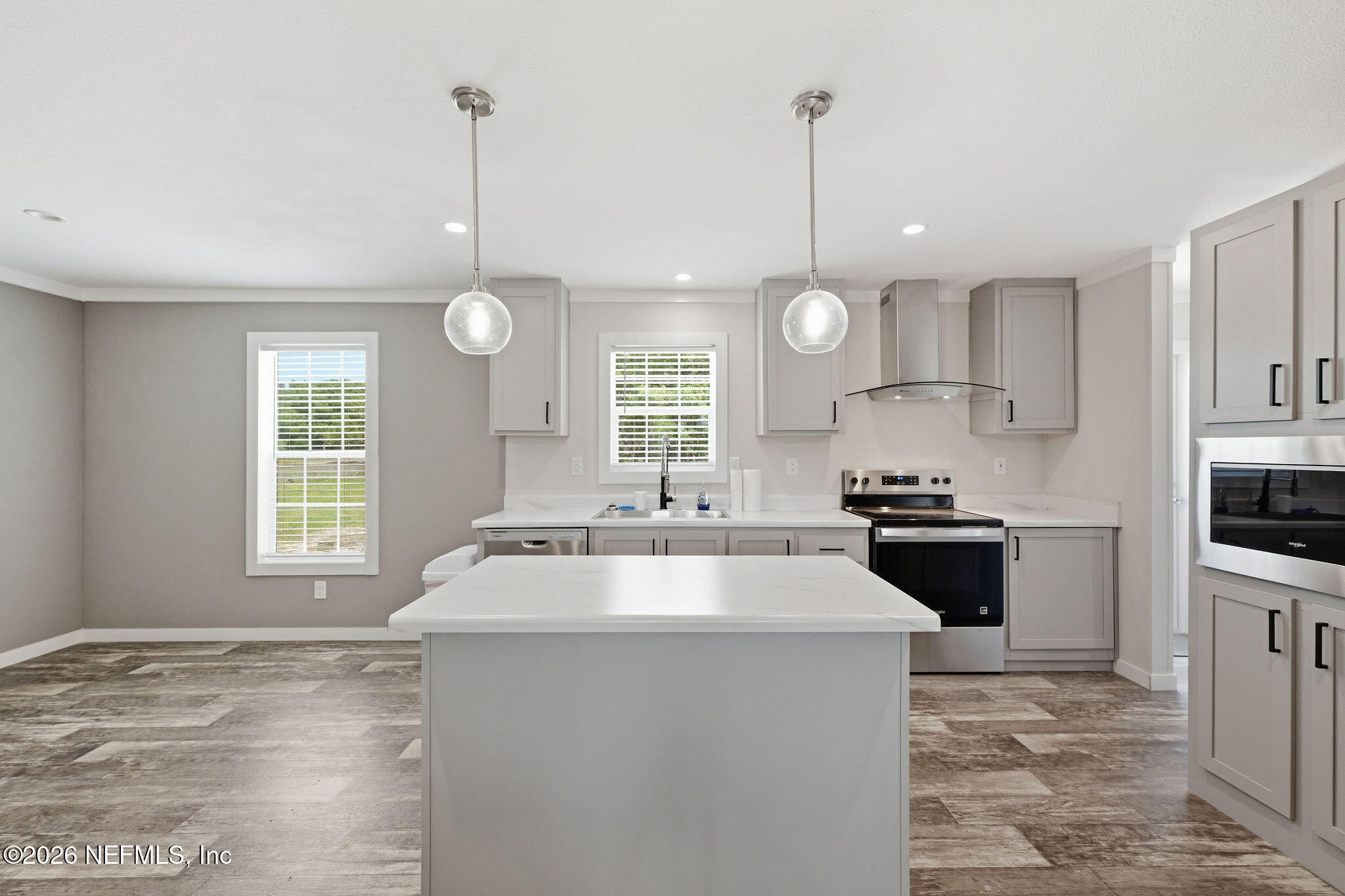 101 Oakhaven Road Pomona Park, FL 32181 - Photo 3 of 23 a kitchen with stove a sink and refrigerator