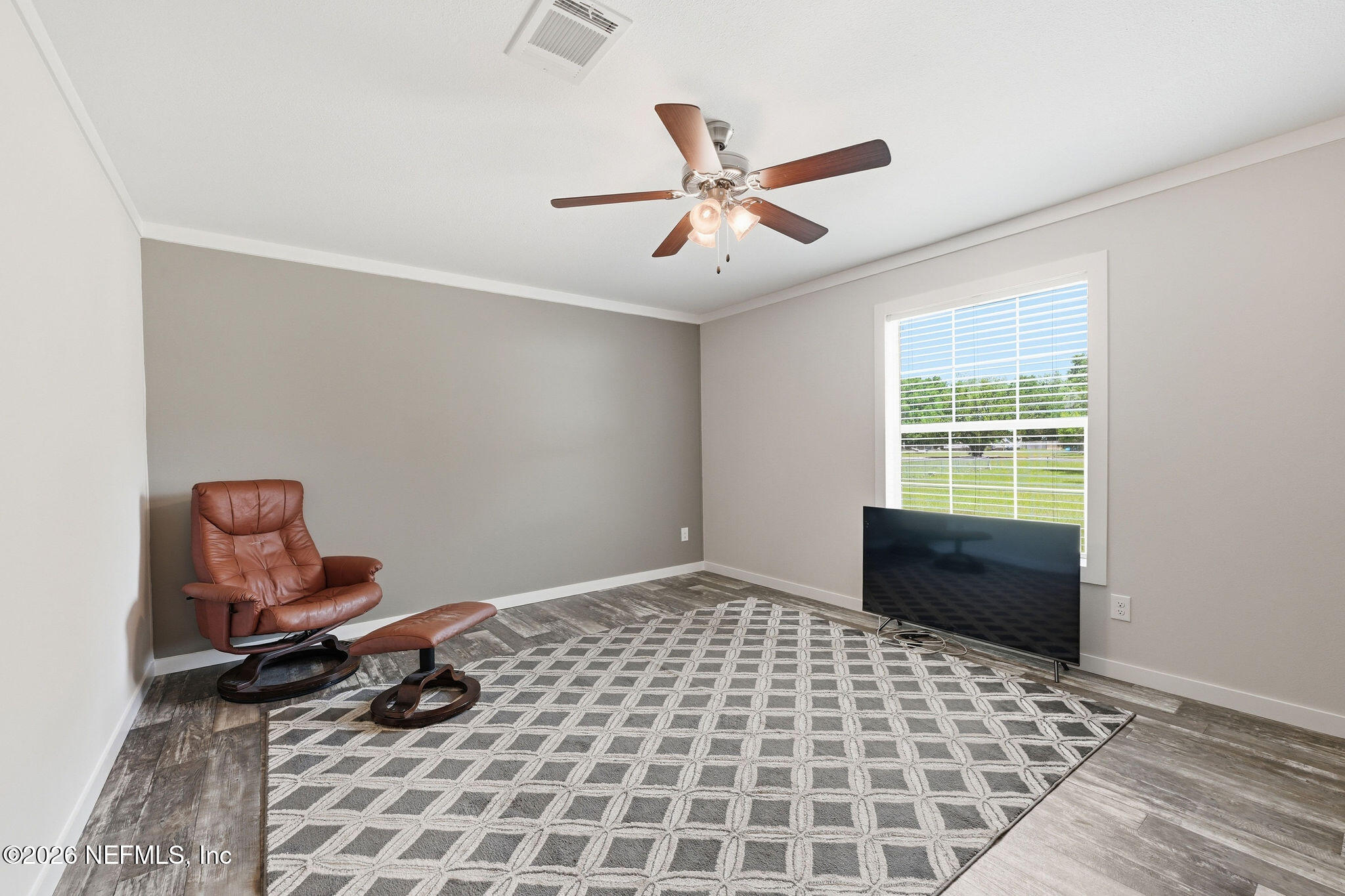 101 Oakhaven Road Pomona Park, FL 32181 - Photo 8 of 23 a bedroom with a bed and window