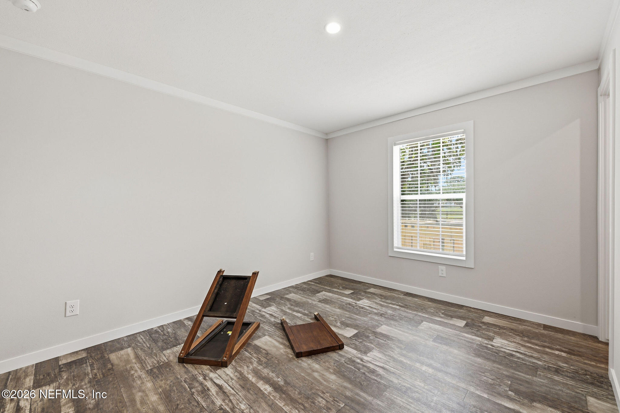 101 Oakhaven Road Pomona Park, FL 32181 - Photo 9 of 23 a view of workspace with wooden floor and windows
