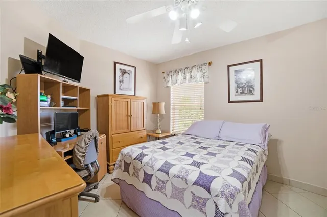 a white toilet sitting next to a white wall