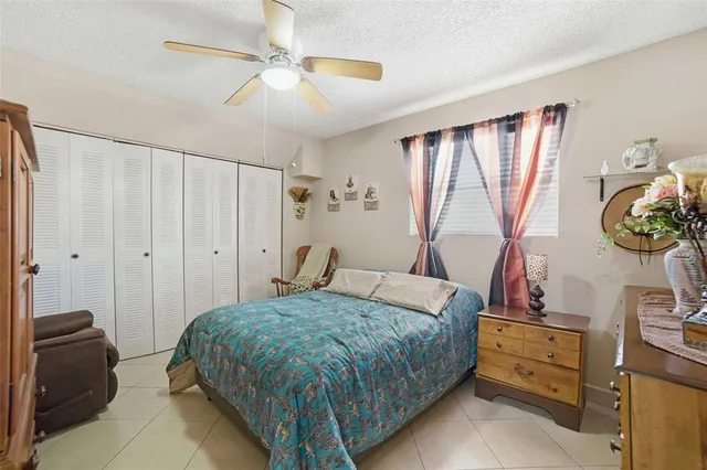 a view of a patio with table and chairs and potted plants