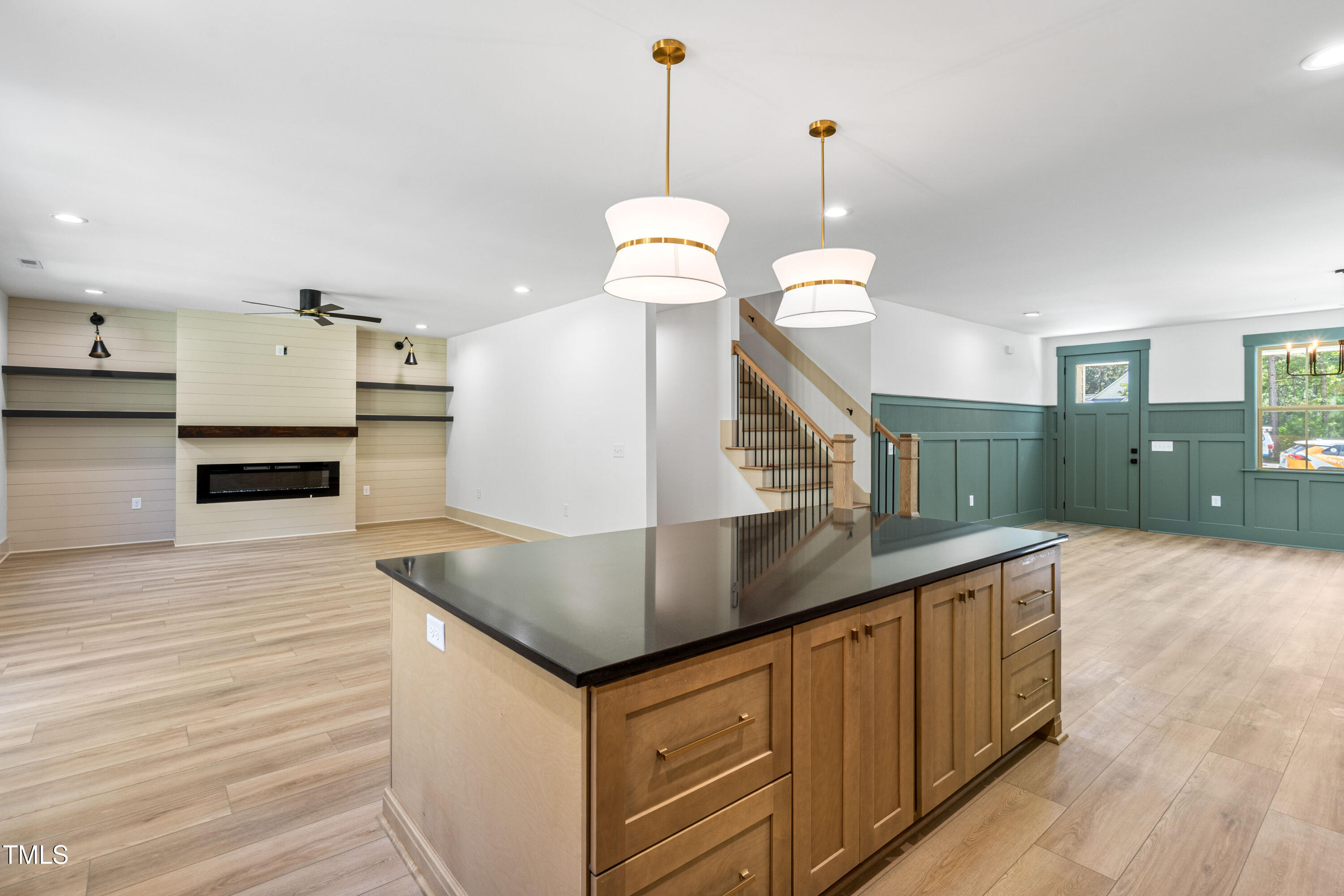 312 Russ Road Smithfield, NC 27577 - Photo 16 of 62 a kitchen with stainless steel appliances granite countertop a sink a stove and a wooden floors