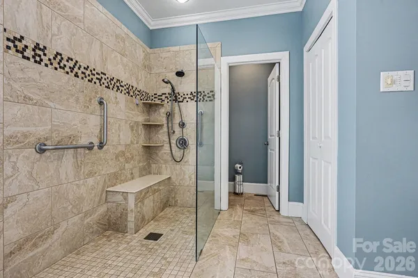 a bathroom with a shower and a toilet