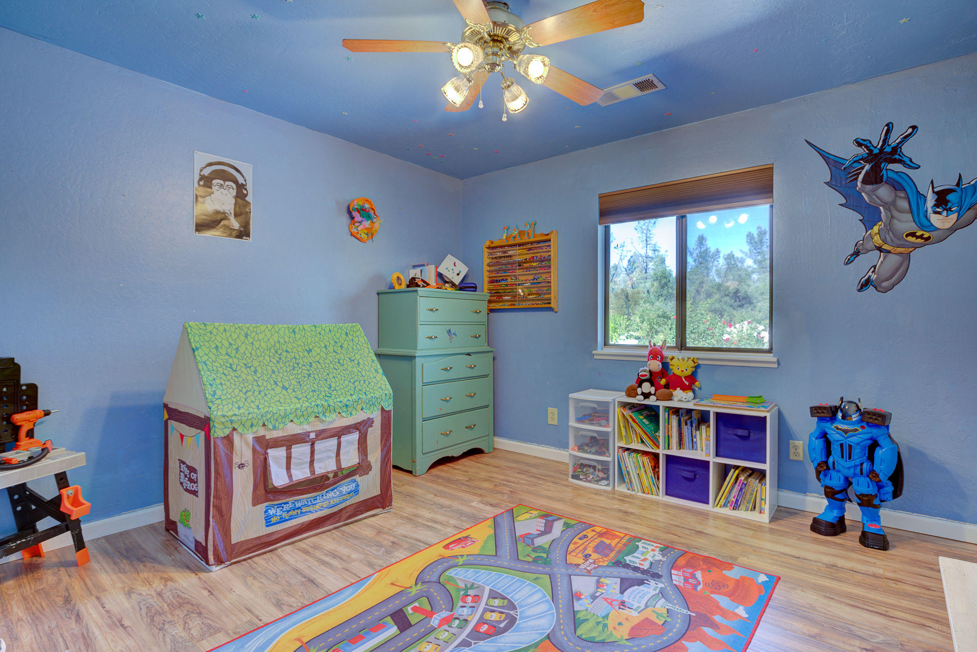 12814 Williamson Road Redding, CA 96003 - Photo 13 of 39 a bedroom with furniture and a book shelf