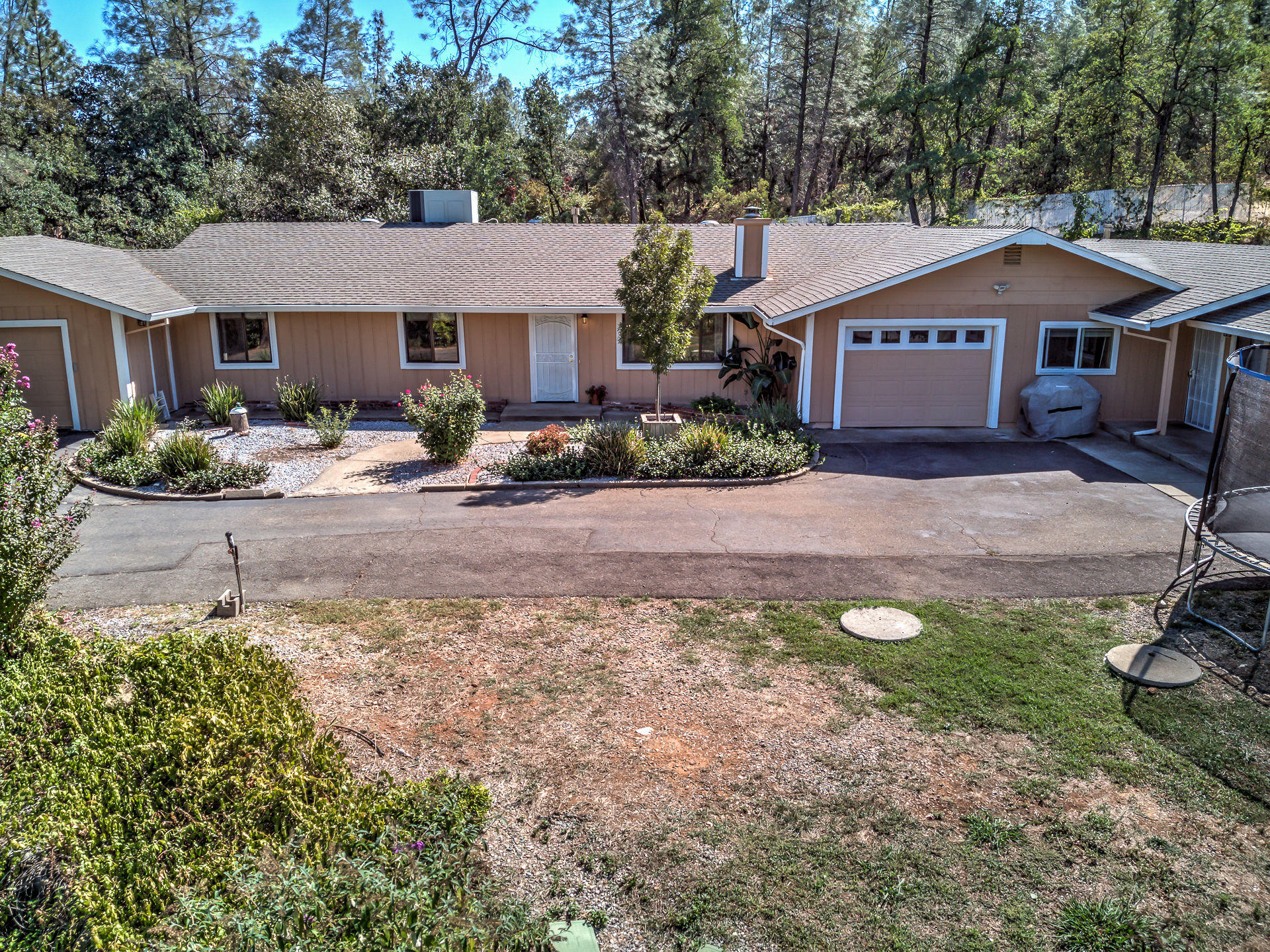 12814 Williamson Road Redding, CA 96003 - Photo 2 of 39 a front view of a house with a yard
