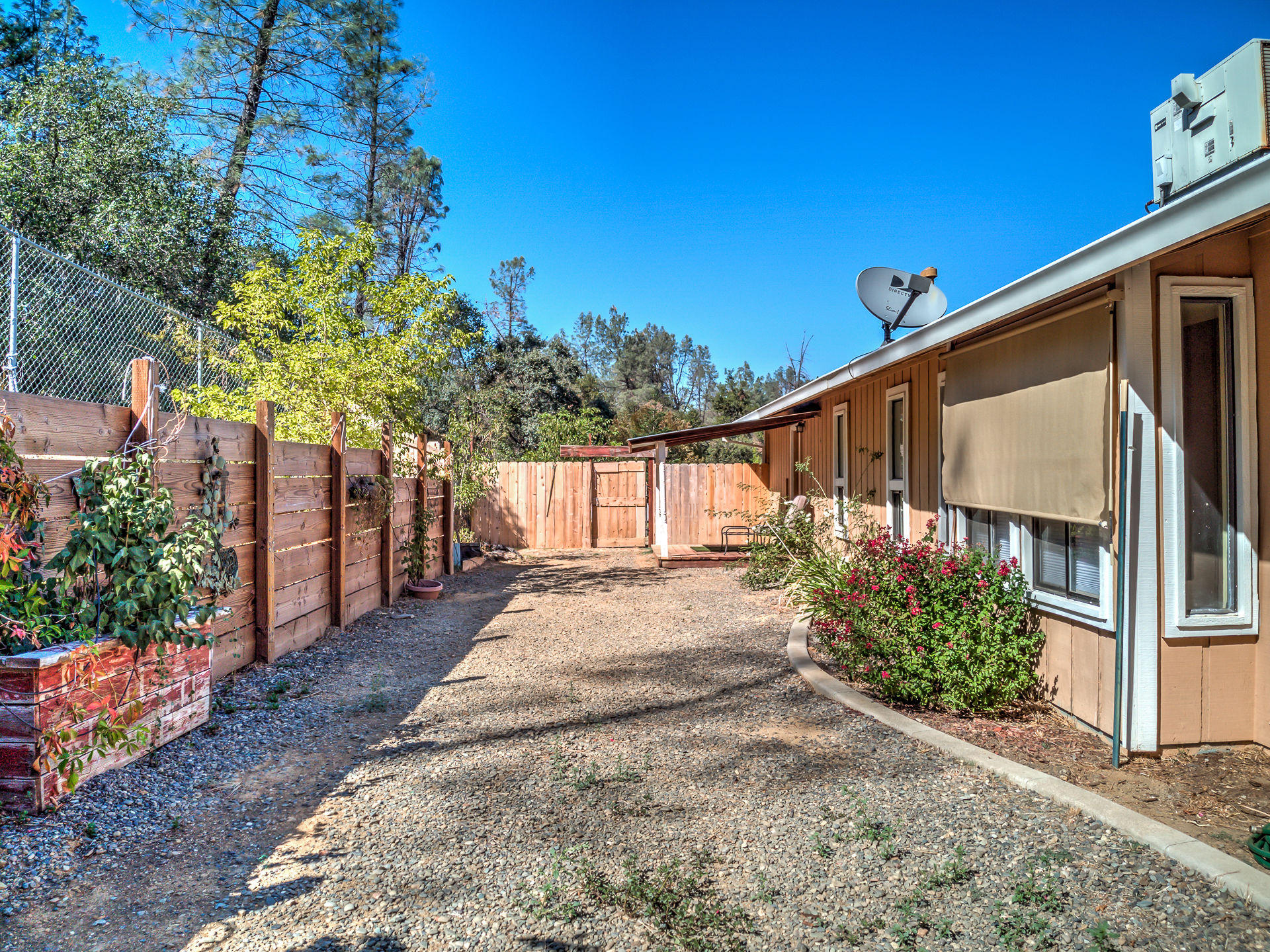 12814 Williamson Road Redding, CA 96003 - Photo 34 of 39 a view of a house with a yard
