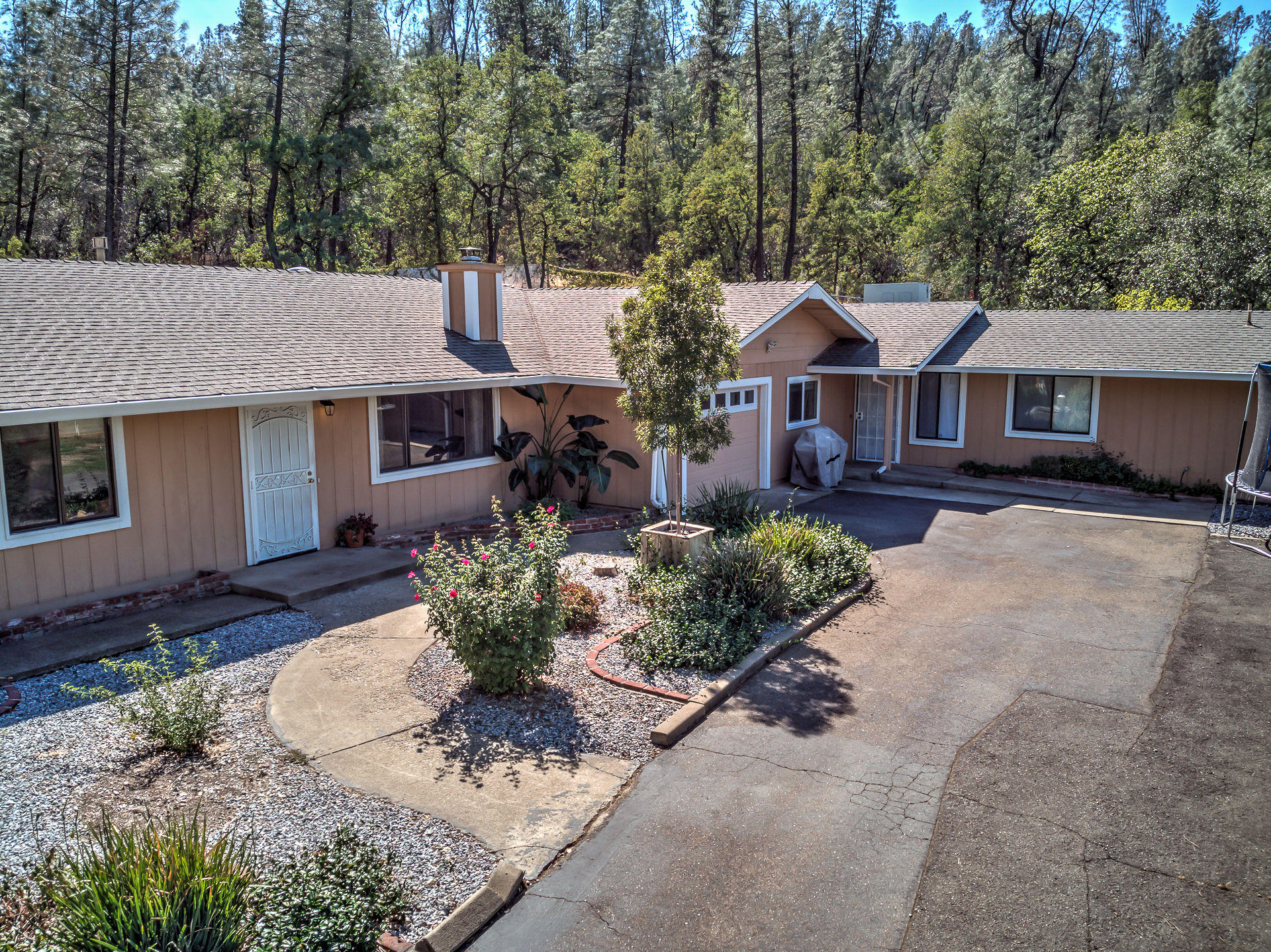 12814 Williamson Road Redding, CA 96003 - Photo 38 of 39 a front view of a house with a yard and outdoor seating