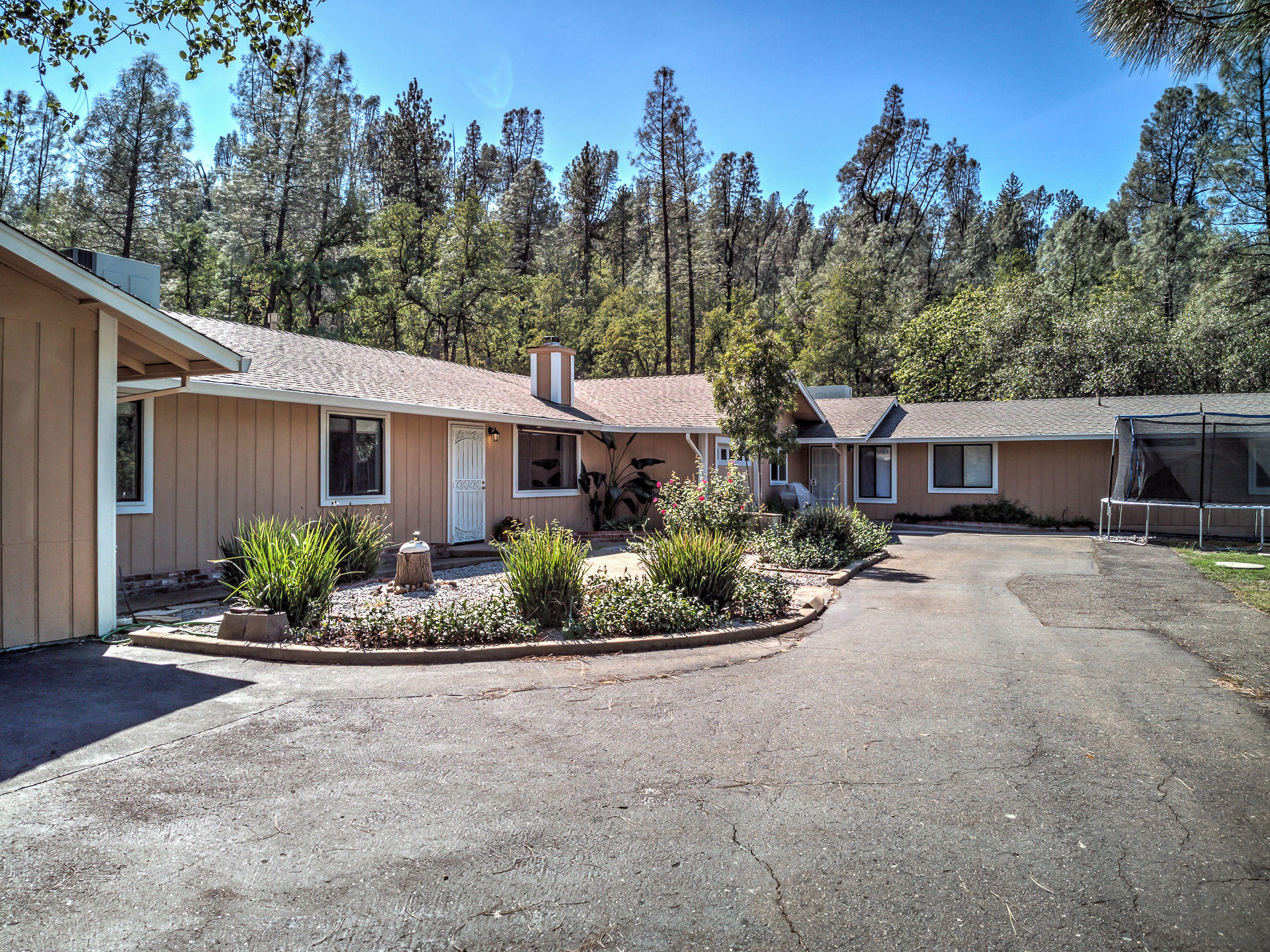 12814 Williamson Road Redding, CA 96003 - Photo 39 of 39 a front view of a house with a garden