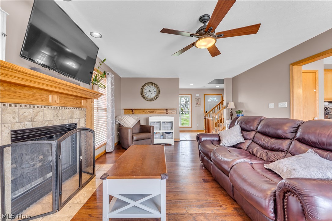 2560 Blake Road Wadsworth, OH 44281 - Photo 13 of 30 Living room with ceiling fan, wood-type flooring, and a fireplace