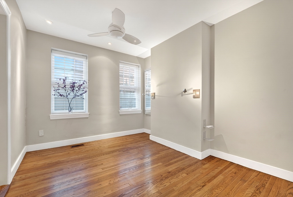 42 Clarendon Street, Unit 1 Boston, MA 02116 - Photo 14 of 26 a view of an empty room with wooden floor and a window