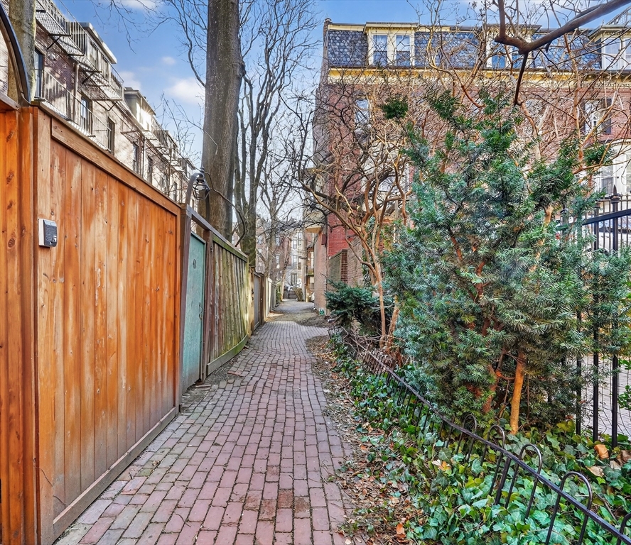 42 Clarendon Street, Unit 1 Boston, MA 02116 - Photo 26 of 26 a pathway of a house with a yard