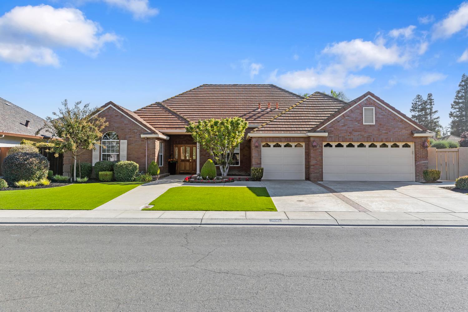 800 Country Club Circle Ripon, CA 95366 - Photo 1 of 1 a house with green field in front of it