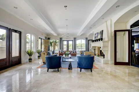 a very nice looking living room with furniture and floor to ceiling window