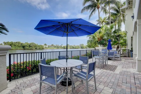 a view of a chairs and table in patio