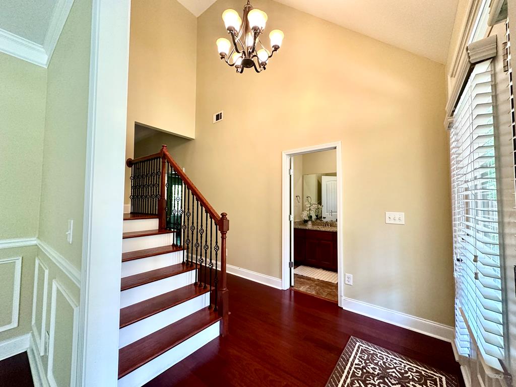 182 Oak Ridge Drive Waverly Hall, GA 31831 - Photo 12 of 67 a view of a hallway with wooden floor and staircase