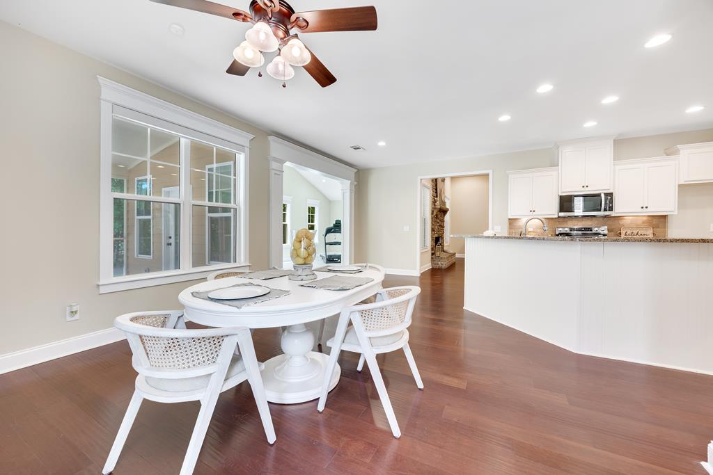 182 Oak Ridge Drive Waverly Hall, GA 31831 - Photo 23 of 67 a view of a dining room with furniture and wooden floor