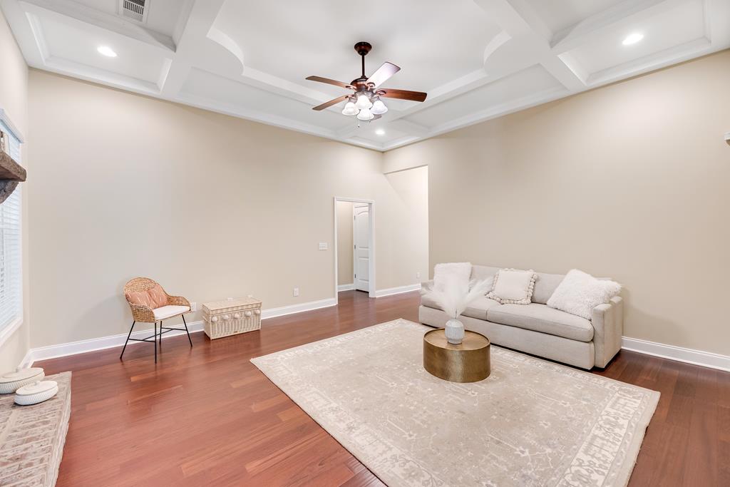 182 Oak Ridge Drive Waverly Hall, GA 31831 - Photo 27 of 67 a living room with furniture and a chandelier