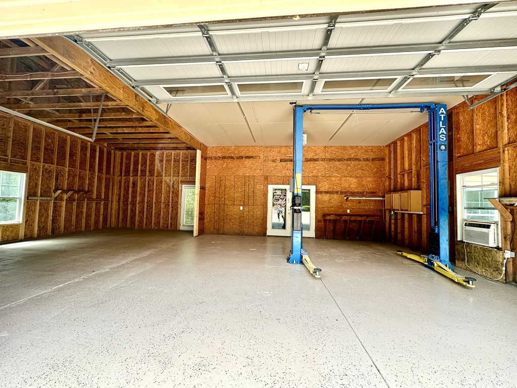 182 Oak Ridge Drive Waverly Hall, GA 31831 - Photo 51 of 67 a view of an empty room with a garage