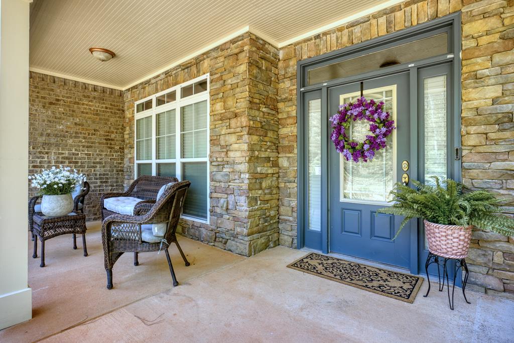 182 Oak Ridge Drive Waverly Hall, GA 31831 - Photo 9 of 67 a view of a porch with furniture
