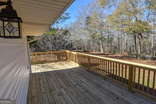 a view of a backyard with large trees