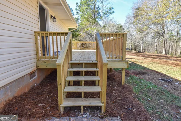 a terrace with wooden floor and fence