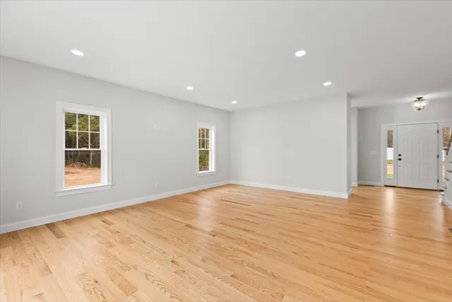a view of entryway with wooden floor and stairs
