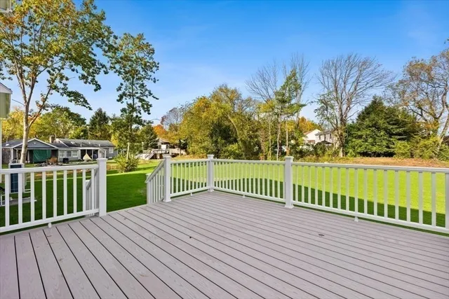 a bedroom with a bed and a ceiling fan