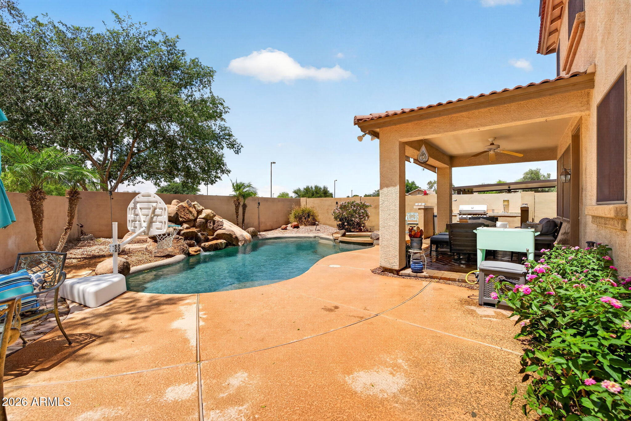 6280 South Sinova Court Gilbert, AZ 85298 - Photo 55 of 64 a view of a backyard with sitting area and slide