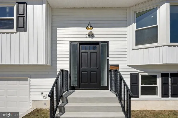a view of entryway with a front door