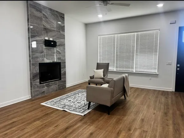 a living room with furniture and a fireplace