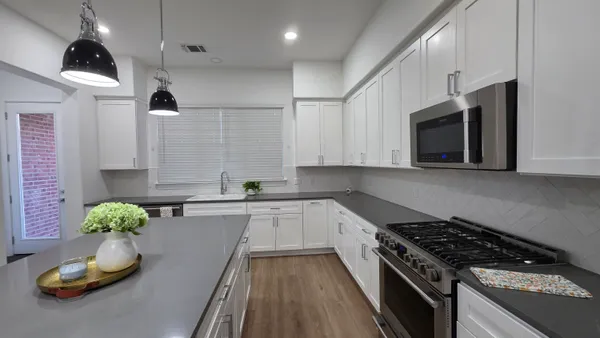 a kitchen with a stove and a microwave