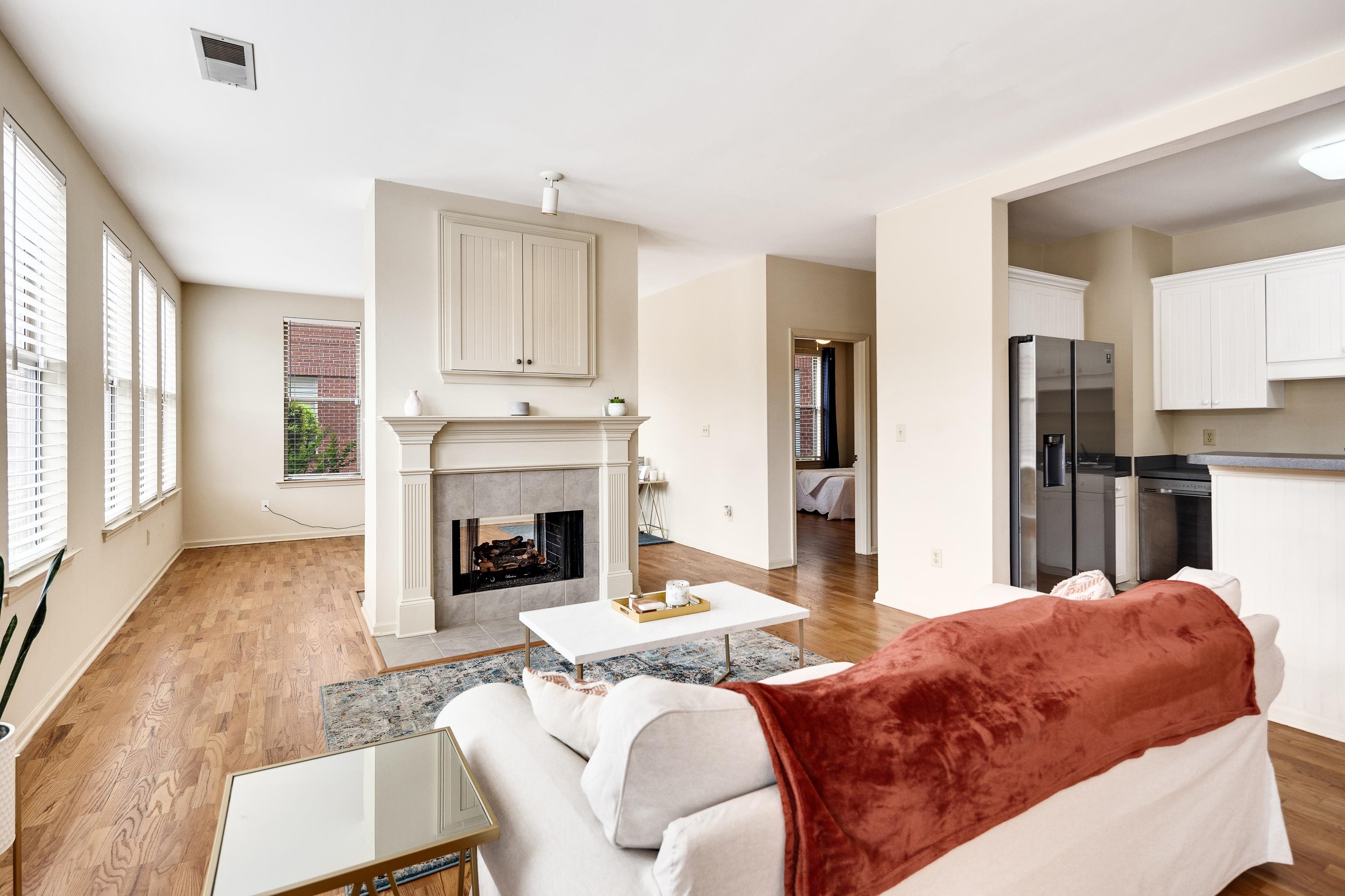 600 South Main Street, Unit 101 Memphis, TN 38103 - Photo 13 of 35 a living room with furniture and a fireplace